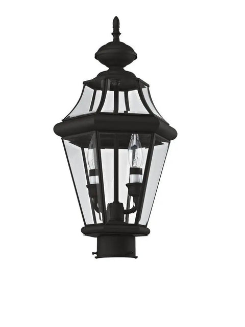 Georgetown 2-Light Outdoor Post Head In Polished Brass With Clear Beveled Glass, weatherproof light fixture close-up view.