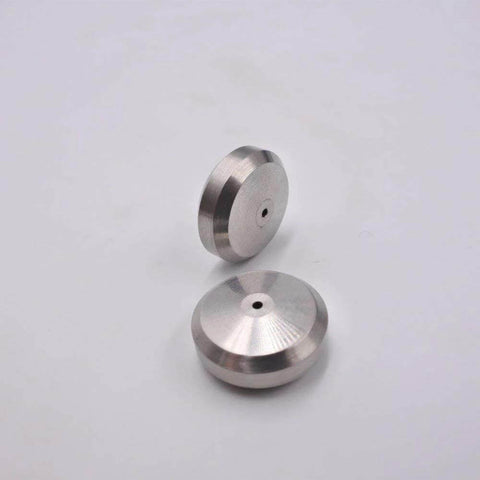 Two metal seat seals for waterjet cutting machines, circular discs with central through-hole, shown in side and top views.