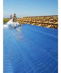 Built Like A Tank Textured Vapor Barrier For Crawlspace Encapsulation And Roof Insulation 1000 Square Feet No Slip Surface, being installed on a roof.