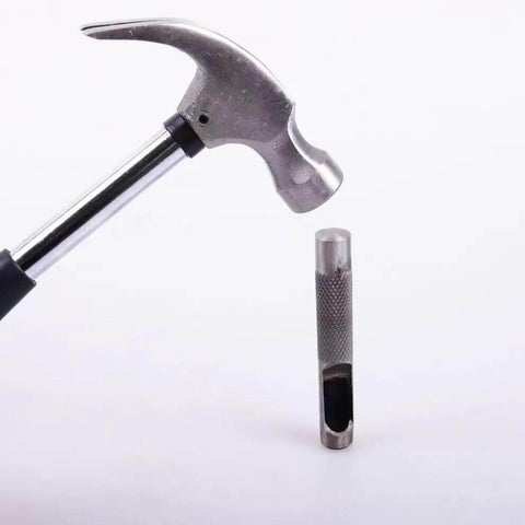 Hammer and steel punch from the Pro Grade Heavy Duty Steel Leather Hole Punch Set Three Piece Grommet Punch Kit