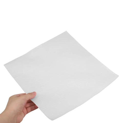 Person holding a single sheet from White EPE Foam Pouches 25 Pack for Fragile Glassware and Delicate Electronics, Shockproof Cushioning Bags