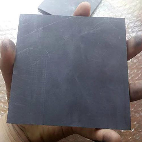 Hand holding Pro Grade Pyrolytic Graphite Plates Pack Of Five 100x50mm With 1mm To 5mm Thickness 99.9 Percent Carbon