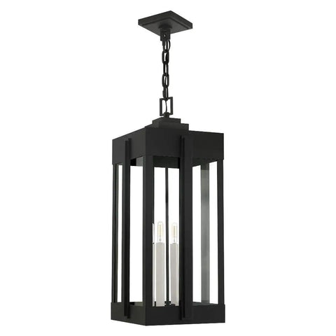 Lexington Extra Large 4 Light Natural Brass Outdoor Pendant Lantern With Clear Glass In Bold Art Deco Shape On Handcrafted Solid Brass Frame hanging securely with a chain.