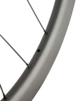 Close-up of the rim of Carbon Fiber Disc Brake Wheelset 700C Clincher Tubeless Ready 45mm Deep 25mm Wide UD Matte Finish