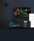 RM4 Mini IR Universal Remote Control With 2.4 GHz WiFi Hub in a living room controlling TV, visible app control interface.