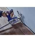 IRWIN Quick-Lift construction jack side view; blue-handled handheld lifting tool with gray metal body.