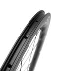 Side view of Tubeless Disc Brake Road Bike Wheelset 25mm Carbon 700c With 45mm 50mm 65mm Rim Options showing rim holes.