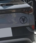 Premium Matte Rock Hand Electric Vehicle Charging Port Decal In Glossy Black Vinyl featuring lightning bolt graphic on grey car.