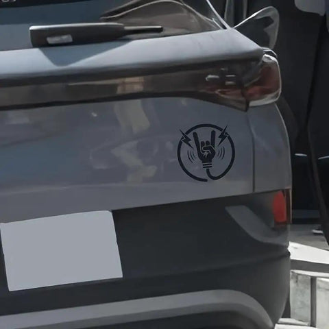 Premium Matte Rock Hand Electric Vehicle Charging Port Decal In Glossy Black Vinyl featuring lightning bolt graphic on grey car.