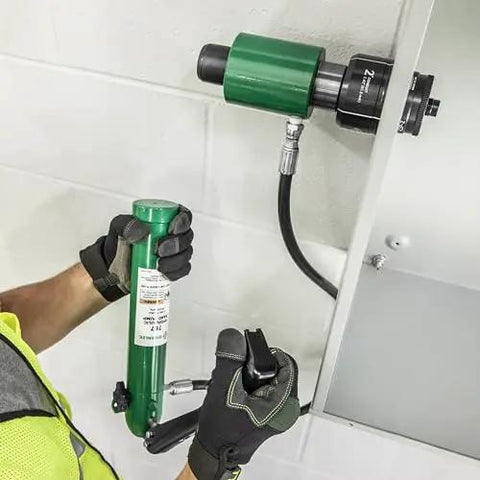 11 Ton Hydraulic Knockout Punch Kit With Hand Pump And Ram in use on metal panel