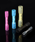 Front view of assorted heat shrink butt connectors in pink, blue, yellow, black, and clear for 16-14 AWG wiring