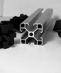 Eight Piece 4040 Aluminum Extrusion End Caps Heavy Duty Rock Solid Killer Grip Made In Usa T Slot Profile Plugs arranged with profile.