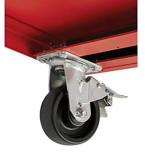 Close-up of the sturdy wheel under the Beefy 52 Inch Mobile Workbench With 11 Soft Close Rollout Drawers And Thick Hardwood Counter Top.