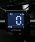 Front view of 48V Ebike Display Meter With Cycling Computer And Speed Control Panel mounted on handlebars.
