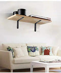 Beefy Heavy Duty 4x4 L Brackets Set For Wood Furniture Shelves used as corner braces on a wall-mounted shelf above a couch