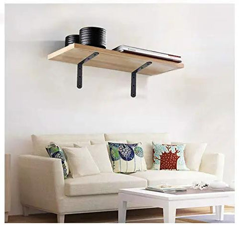 Beefy Heavy Duty 4x4 L Brackets Set For Wood Furniture Shelves used as corner braces on a wall-mounted shelf above a couch