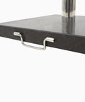 62.8 Lb Granite Patio Umbrella Base Stand Heavy Duty Outdoor Market Umbrella Base Square Pole Holder Black 17.7 By 17.7 By 2 Inches Sturdy Parasol Weight For Windy Decks And Patios Non Slip Bottom Weather Resistant Construction, showing metal handle and pole holder.