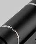 Close-up of Invisible Door Hinge With Automatic Closer And Hydraulic Spring Damping, sleek black finish for cabinets and furniture.