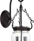 Everett 2 Light Wall Sconce In Olde Bronze with clear melon glass shade, traditional steel design for indoor lighting fixture.