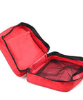 Open red first aid bag with black zipper and inner mesh pocket.