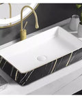 Nordic Black Bathroom Vessel Sink - Small Above Counter Wash Basin with elegant gold accents on a modern countertop.
