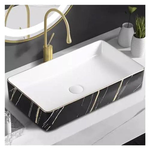 Nordic Black Bathroom Vessel Sink - Small Above Counter Wash Basin with elegant gold accents on a modern countertop.