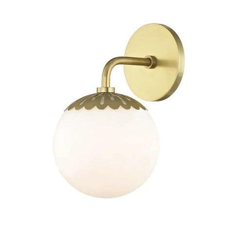 Paige 1 Light Bath Vanity Light In Aged Brass Finish, 11 Inches Tall By 6.25 Inches Wide, with round white globe shade.