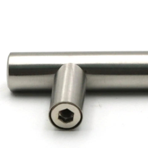 Close-up of stainless steel T type drawer cabinet pull handle in silver finish, durable hollow design for kitchen cupboard doors and wardrobes.