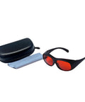 Slick Laser Safety Goggles Featuring Badass OD7 Plus Optics, black frames with deep red lenses, case, and cleaning cloth.