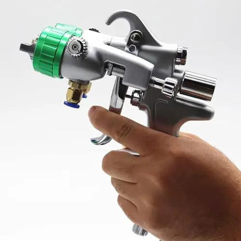 Close-up of Heavy Duty Dual Nozzle Pneumatic Paint Sprayer With Pressure Feed For Smooth Coating On Any Workpiece Featuring Stainless Steel Tips.