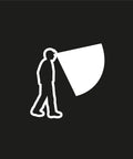 Silhouette of person using Tikkina Compact Headlamp With 300 Lumen Brightness for hiking with visible light beam.
