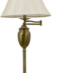 Close-up of Wellington Steel Swing Arm Floor Lamp In Antique Brass with faux silk shade and adjustable arm, modern design.