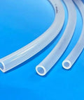 Side view: three clear silicone tubes, 1/8 in ID × 1/4 in OD, on blue background