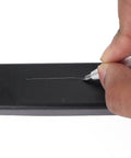 User marking a black surface with Heavy Duty Tungsten Carbide Scriber Engraving Pen For Marking Steel Metal Wood.