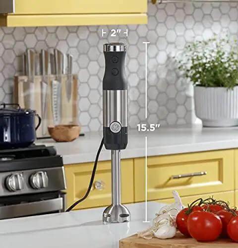 No Sweat 500 Watt Stainless Steel Immersion Blender With Removable Whisk And Spout Blending Jar For Thick Smoothies Quick Purees And Bold Homemade Sauces Dual Speed Hand Blender Kit standing on a kitchen counter.