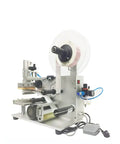 Heavy Duty Semi Automatic Flat Surface Labeling Machine With Vacuum Pump showing its stainless steel build and labeling mechanism.