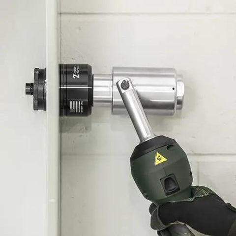 Using 11 Ton Battery Hydraulic Knockout Punch Kit With Slugbuster For Half Inch To Two Inch Conduits on wall