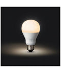 Smart White LED A19 Bulbs Starter Kit With Hub Dimmable 60W Equivalent bulb glowing on black background