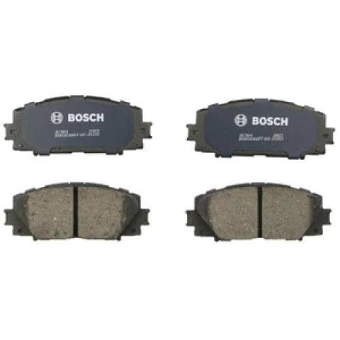 Bosch BC1184 QuietCast ceramic brake pad set for front, four pads with blue backing plates.