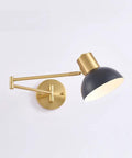 Badass Industrial Metal Swing Arm Wall Sconce With Rock Solid Adjustable Dome Shade And E27 Socket Hella Sturdy For Bedroom Reading Vibes And Slick Black Brass Finish Modern Wall Lamp mounted on a wall, highlighting its gold and black finish.