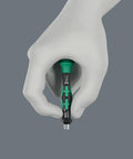 Hand holding a Micro Bitholding Screwdriver With 4 mm External Hex Drive, ergonomic handle and anti-roll cap visible