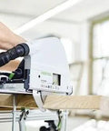 Precision Plunge Saw Featuring Slick Blade Swap Tech And Anti Splinter Guard For Crisp Cuts On Any Build being used on a wooden surface.