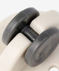 Close-up of Peel And Stick Swivel Casters Smoother Than Snow Abs Ball Bearing Furniture Wheels showing gray wheels and white frame.