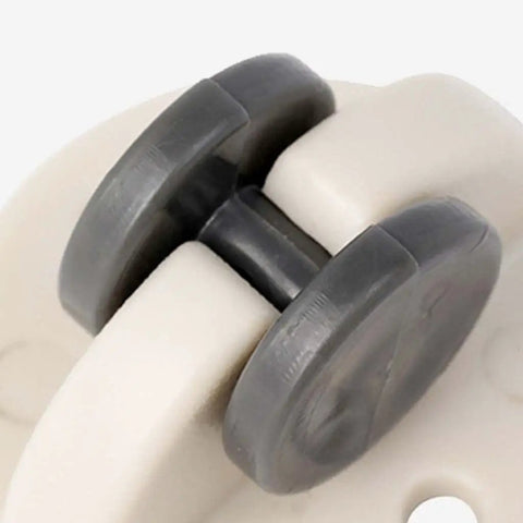 Close-up of Peel And Stick Swivel Casters Smoother Than Snow Abs Ball Bearing Furniture Wheels showing gray wheels and white frame.