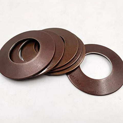 Front view of several brown metal disc springs (cup springs) stacked with central holes