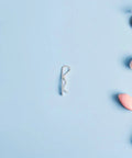 Top Tier Stainless Steel Cotter Pins R Shape For Mechanical Assembly Fasteners on blue background with beauty products.