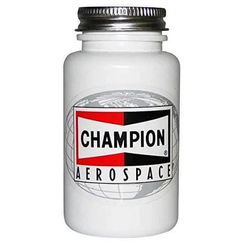 Champion Aerospace container; labeled for spark plug maintenance, likely containing anti-seize compound.