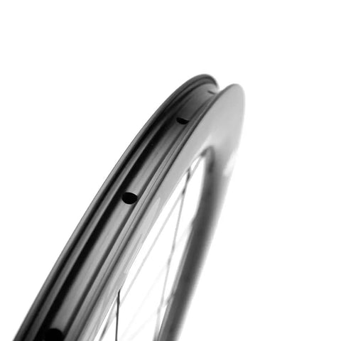 Close-up of Ridiculously Light Carbon Disc Wheelset for Road Bikes Tubeless Ready Six Bolt Rotors 50CU25 high strength rim