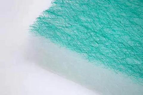 Close-up of Straight Up Solid Green Fiberglass Paint Arrestor Roll for Spray Booth Floor Filters showing texture and material detail.