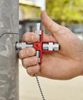 Hand using All-In-One Universal Control Cabinet Key With Nine Die-Cast Zinc Profiles for electrical cabinet access outdoors.